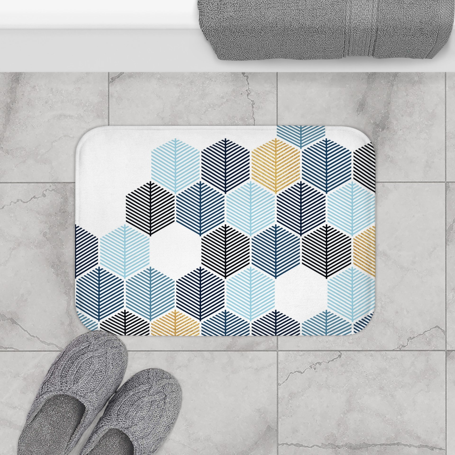 Abstract honeycomb-shaped trees design bath mat in navy blue, rackley blue, light blue and gold (not glittery) on a white background.
