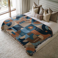 Blue and Brown Abstract Geometric Shapes Woven Cotton Blanket on a queen bed