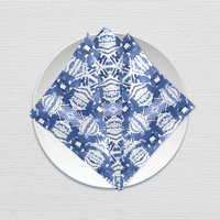 Blue Ikat Pattern Cotton Napkin, folded on a plate