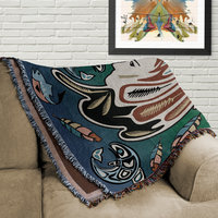 Shananic Medicine Woman Blanket folded on a couch