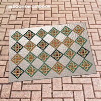 Out door mat with Six inch diamond tile pattern with intertwined Celtic knots in tones of olive green, burnt orange and black on an interesting light taupe textured background that resembles frosted glass.