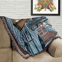 Snowy Winter Woven Cotton Blanket, Country Farmhouse Landscape folded on a couch