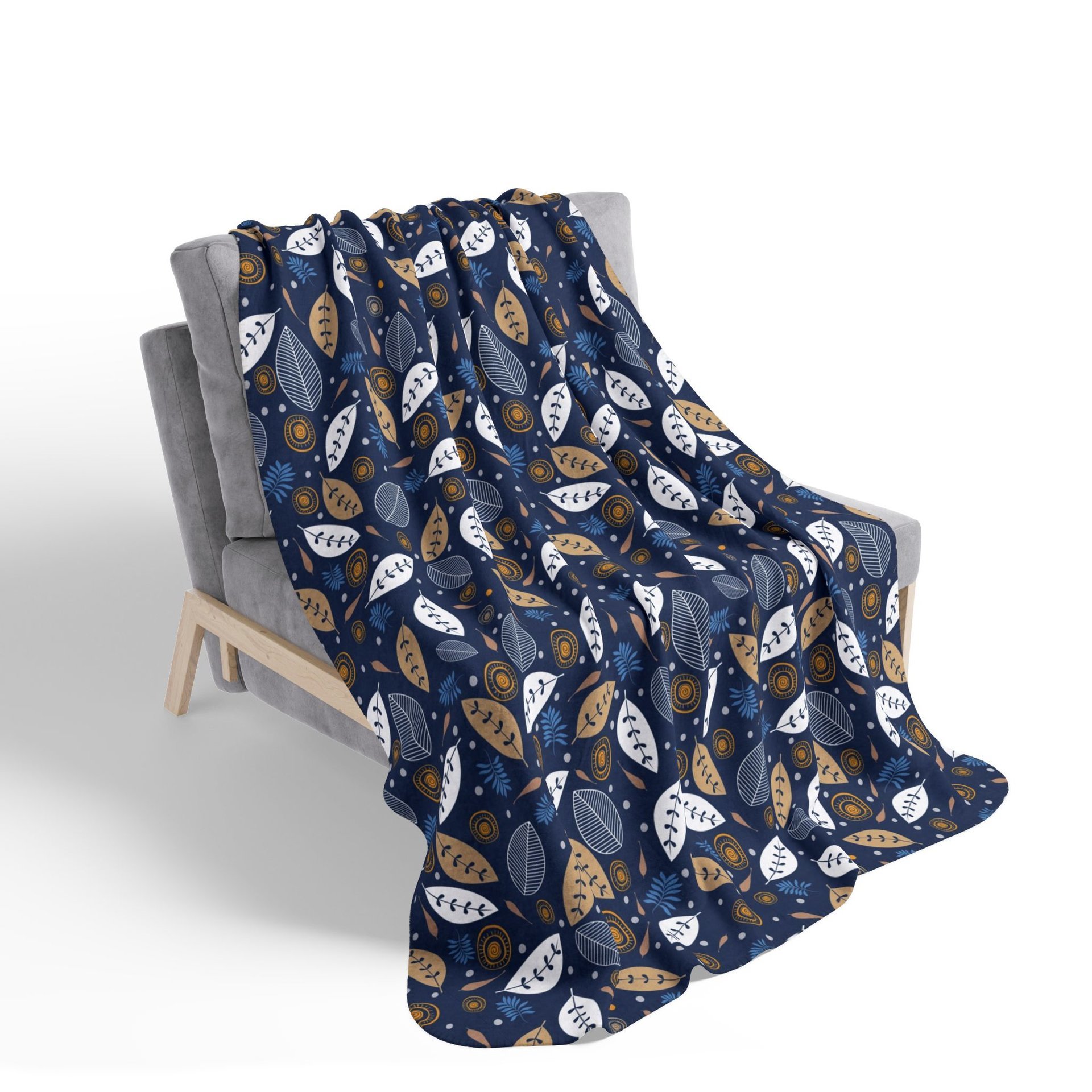 Botanical art printed on a lightweight, soft and fluffy two-sided reversible plush velveteen throw blanket in white, navy blue, tan, gray, orange and brown. One side is printed on a white background and the other side is printed on a navy blue background.